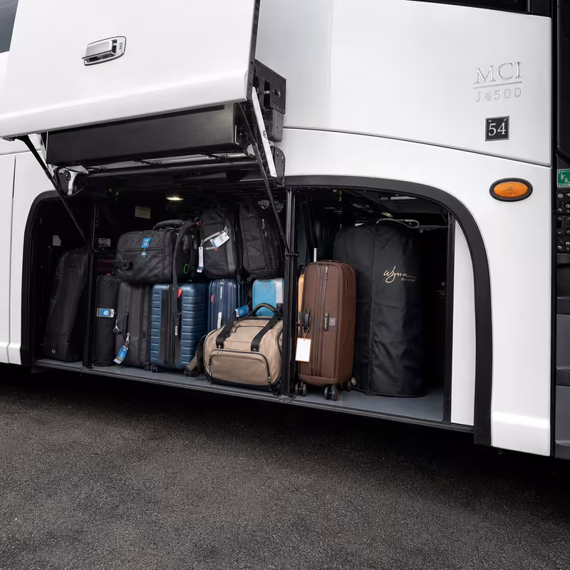 Party bus interior with wraparound leather seating and LED lighting in San Bernadino