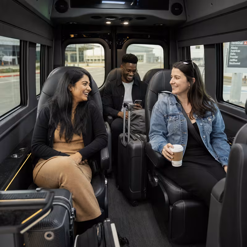 Passengers loading luggage while boarding an San Bernadino group shuttle