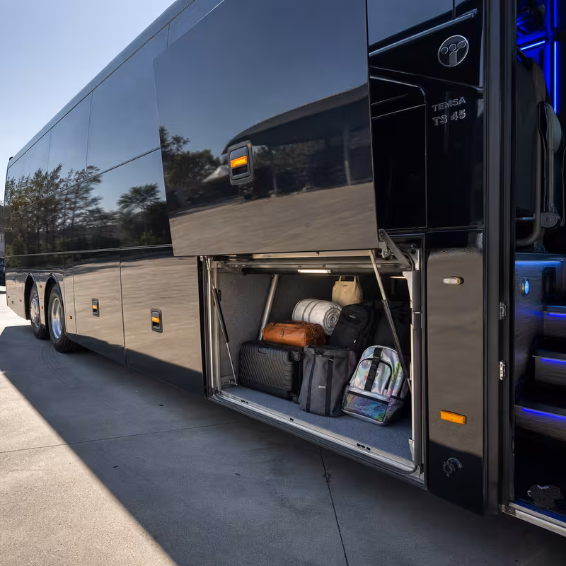 Party bus interior with wraparound leather seating and LED lighting in San Bernadino