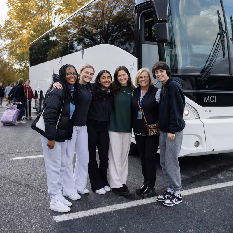 Passengers loading luggage while boarding an San Bernadino group shuttle