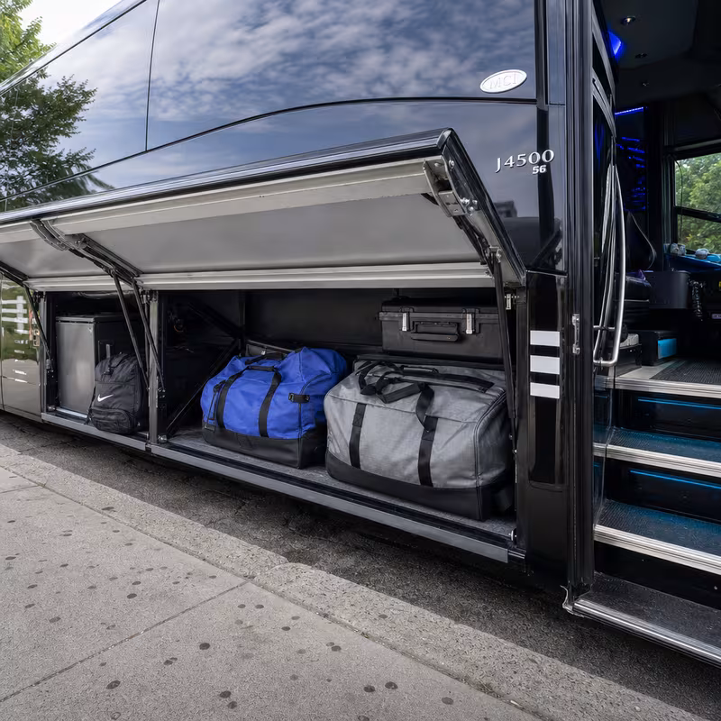 Party bus interior with wraparound leather seating and LED lighting in San Bernadino
